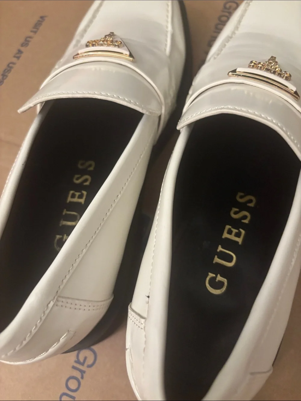 NWOT Guess White Slip-On Penny Loafers with Gold Triangle Logo